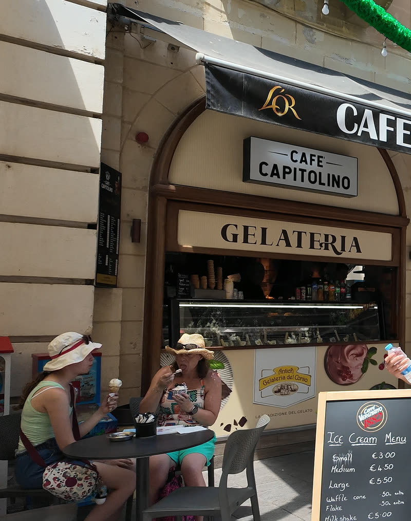 Official terrace seating photograph opposite St John's Co-Cathedral, provided by Café Capitolino under authorized editorial partner publication rights